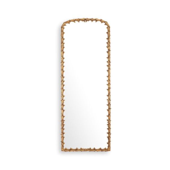 An elaborate vintage brass wall mirror with intricate leaf detailing