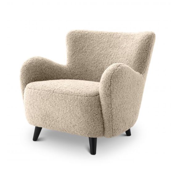 A luxurious fluffy cream-coloured mid-century inspired armchair