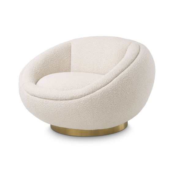 A sumptuous swivel chair by Eichholtz with a chic circular design, beautiful boucle cream upholstery and glamorous brushed brass base