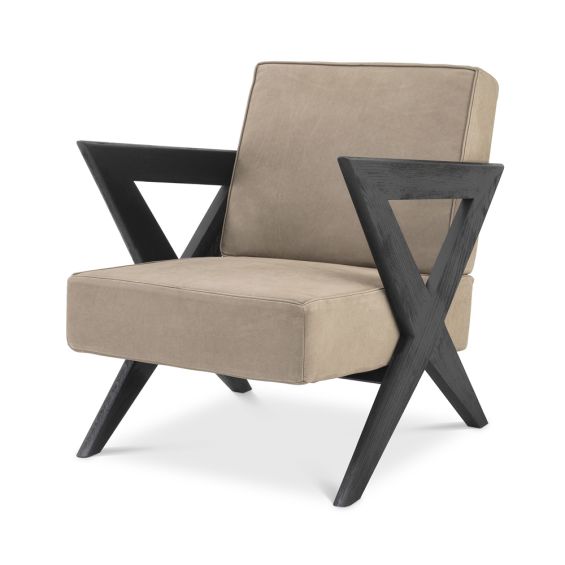 A chic, tan-toned leather armchair with contrasting dark brown x-shaped legs