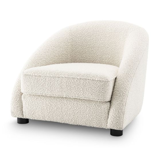 Luxurious boucle cream armchair with sloped arms by Eichholtz