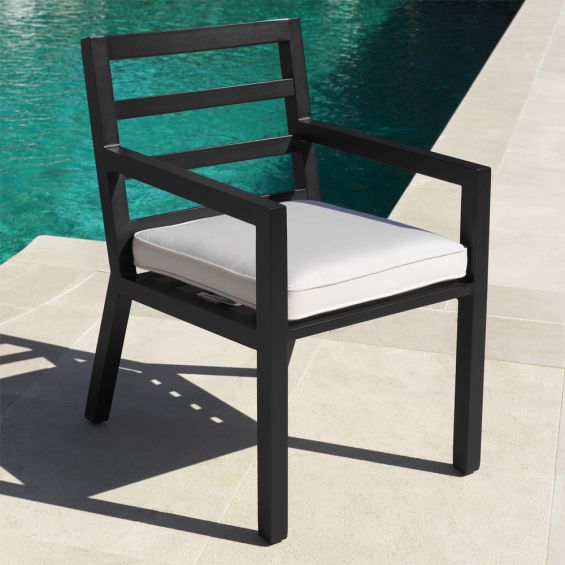 Contemporary black finish outdoor dining chair with neutral cushion by Eichholtz
