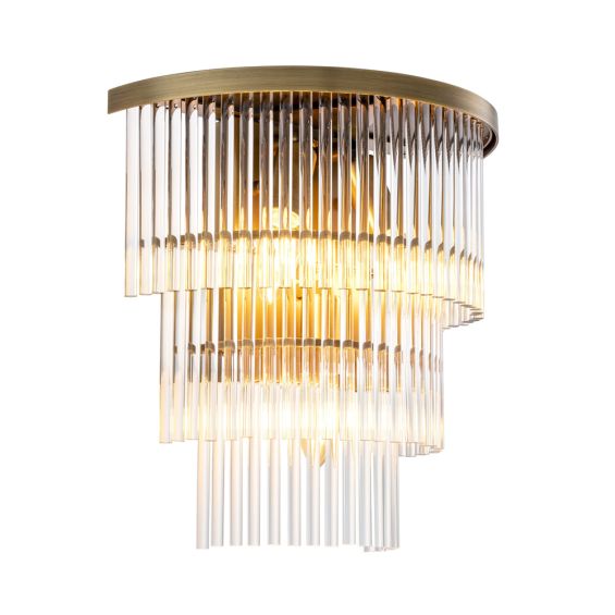 A chic clear glass and antique brass wall lamp