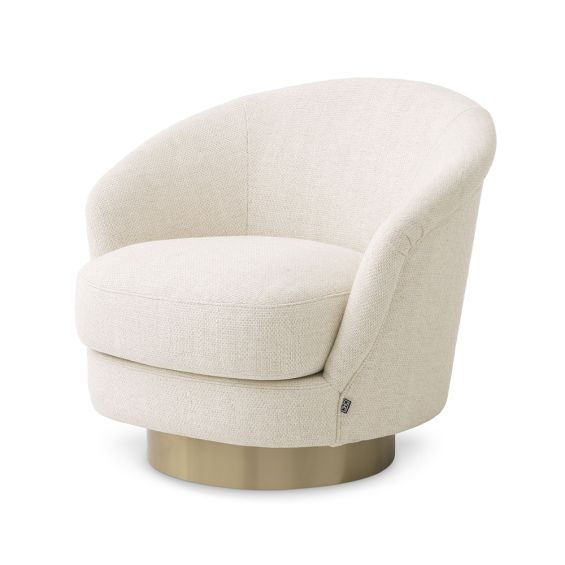 A luxury swivel chair by Eichholtz with a Pausa Natural upholstery and brushed brass base