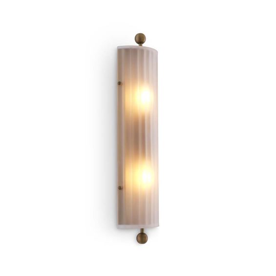 A delicate frosted glass wall lamp with antique brass details