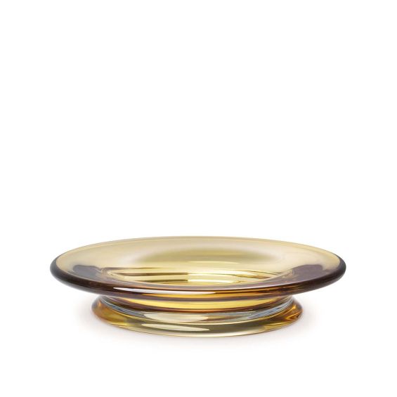 A handcrafted bowl blown from yellow glass.