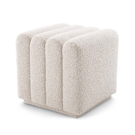 A boucle cream stool with deep channel stitching fit for any modern decor