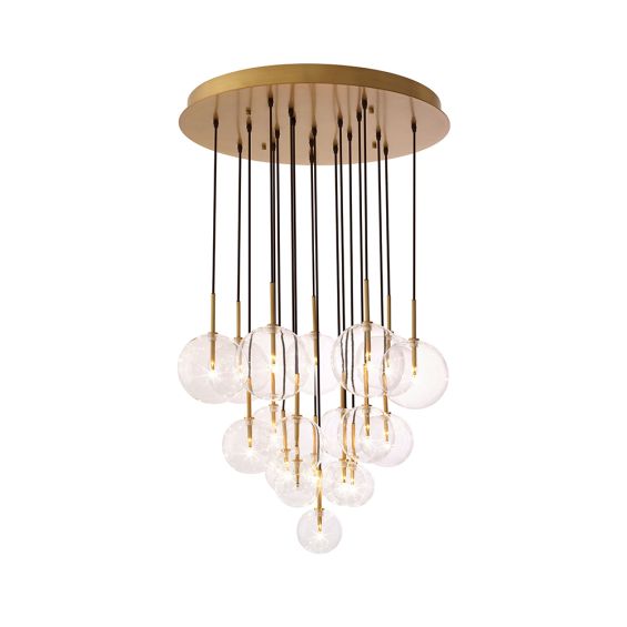 A luxury statement chandelier by Eichholtz with twelve hanging, clear glass spheres and an antique brass finish