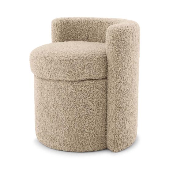 A fluffy stool upholstered in a sand coloured fabric with a curved back.