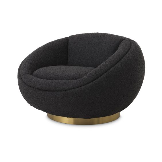 A luxurious swivel chair by Eichholtz with a curvaceous design, sumptuous boucle black upholstery and glamorous brushed brass base