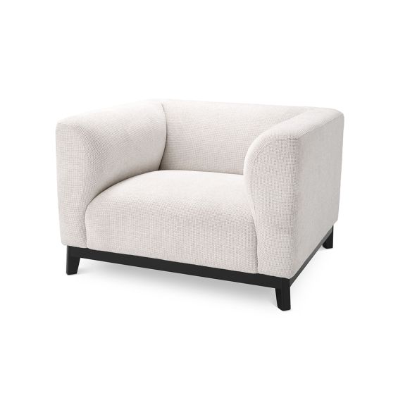 A chic armchair by Eichholtz with a Lyssa Off-White upholstery and black base