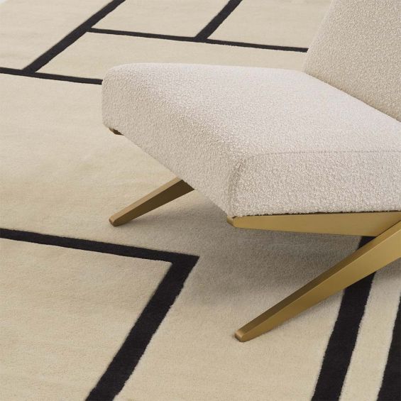 Off-white and black geometric patterned rug made from New Zealand wool.