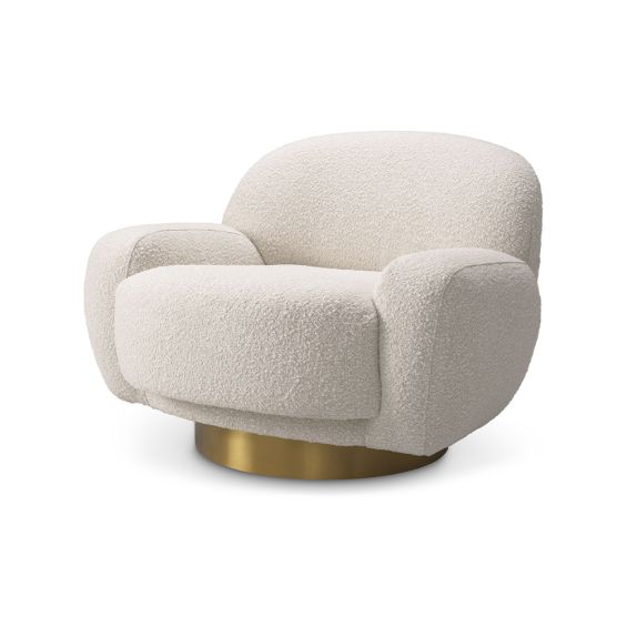 A curvy swivel chair by Eichholtz with a bouclé cream upholstery and brushed brass base 