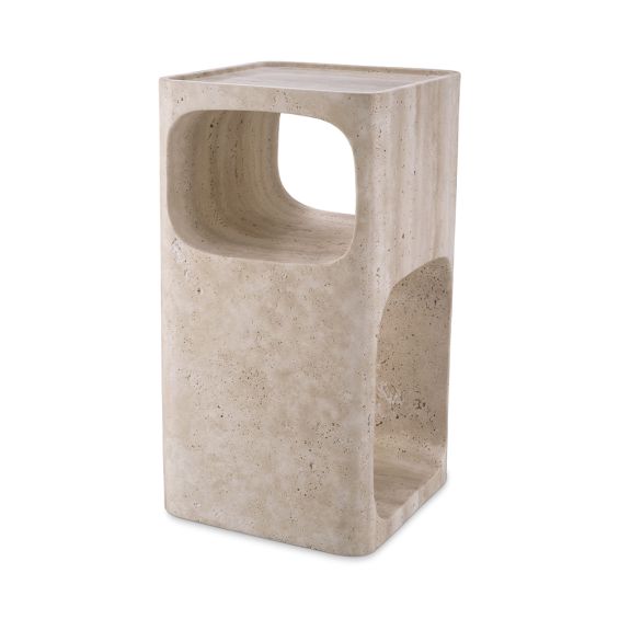 A sculptural side table by Eichholtz crafted from travertine with a Mid-Century appeal and multiple storage levels