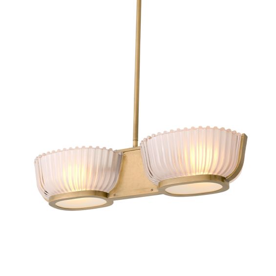 An elegant chandelier by Eichholtz with a vintage brass finish and frosted glass shades