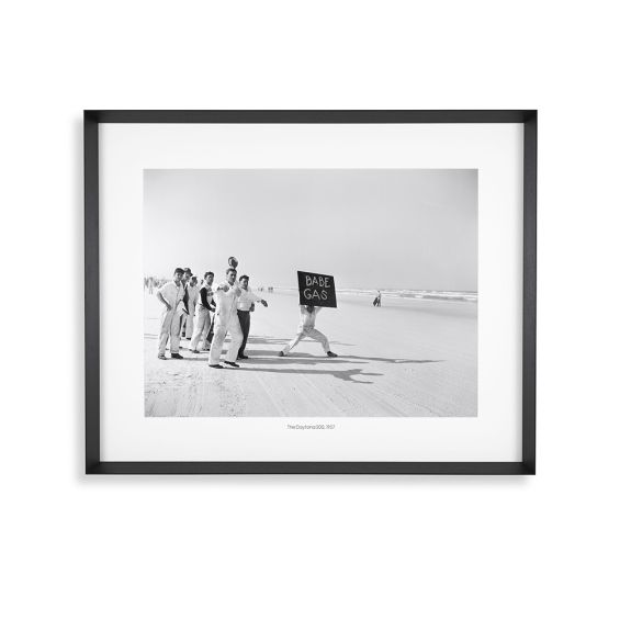 A monochrome photograph by Joseph Scherschel that depicts a group of spectators during a motorsport race during the 1950s