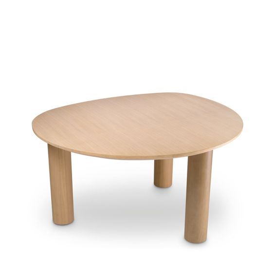 A rounded dining table by Eichholtz with a natural finish