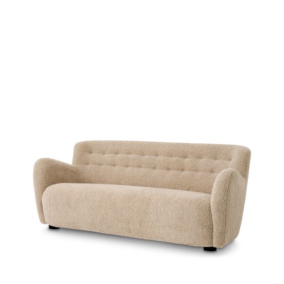 Cosy canberra sand upholstered sofa with sumptuous curves and deep stitching details
