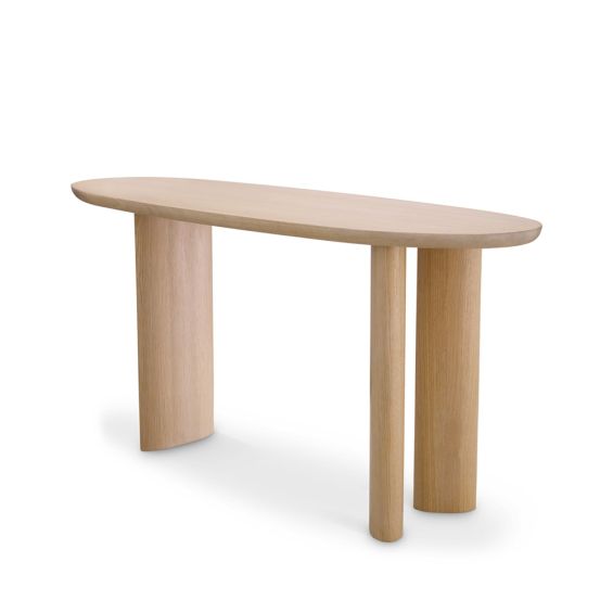 A gorgeous console table by Eichholtz with a natural finish and asymmetrical legs