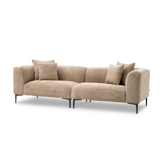 A luxury sofa by Eichholtz with a Lyssa sand upholstery and black legs