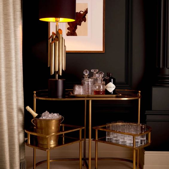 Vintage brass trolley paired with elegant mirrored glass top and clear glass layer