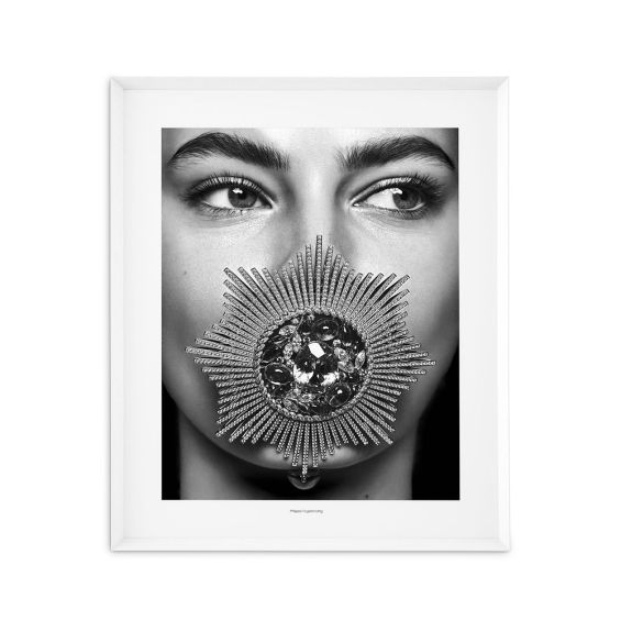 Black and white print featuring a woman with a jewel in her mouth in a sleek white frame