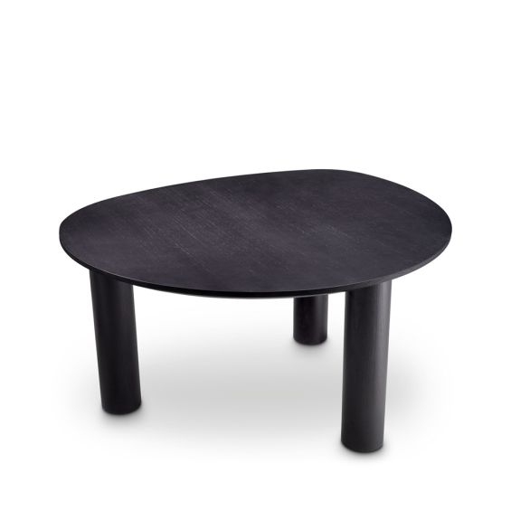 A luxurious black dining table by Eichholtz with a rounded table top 