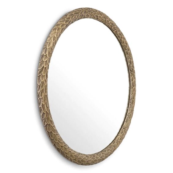 Round wall mirror with artisanal leaves pattern finished in vintage brass