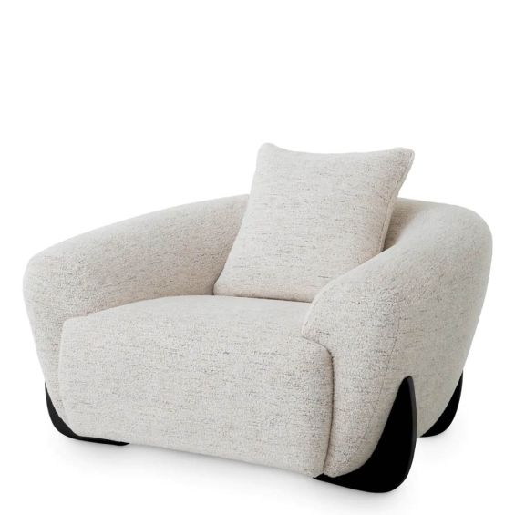 A luxury chair by Eichholtz with a grey upholstery and black wooden legs