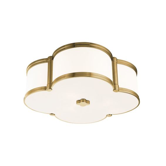 A luxurious aged brass and white glass ceiling lamp