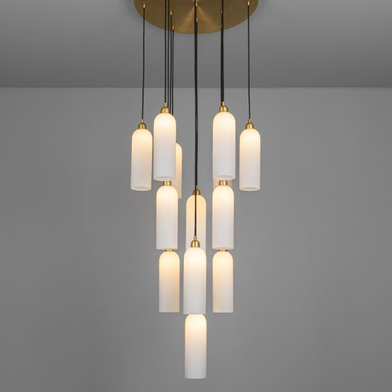 A luxurious chandelier by Schwung with translucent opal glass lampshades and a solid brass structure