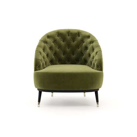 An elegant, deep-buttoned velvet armchair with metal accents