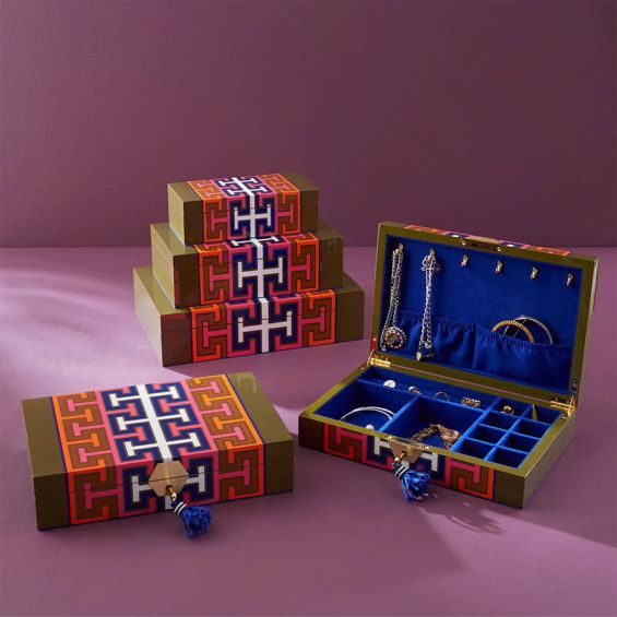 A bold jewellery box by Jonathan Adler with a geometric pattern and luxury blue velvet lining 