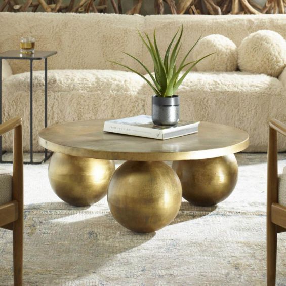 Antique brass coffee table with three bulbous legs