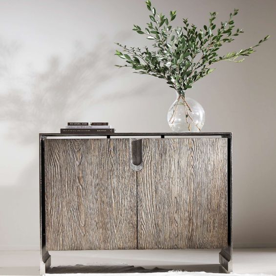 A beautiful two drawer chest from Bernhardt featuring a white oak veneer inner case and an aluminium outer case with a nickel finish