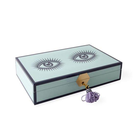 Striking eye-design jewellery box in pastel blue with lilac velvet interior and brass accents