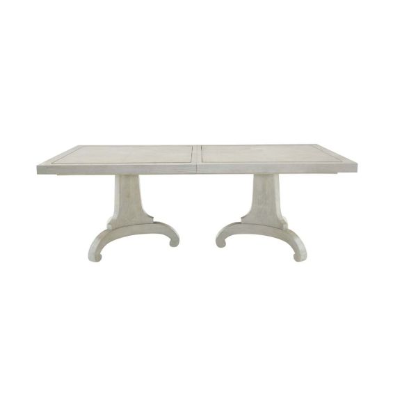 A provincial inspired dining table with extendable leaf