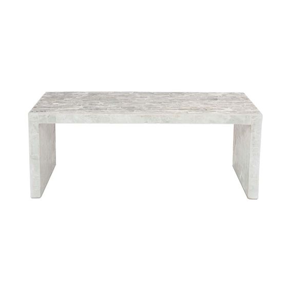 A grecian inspired coffee table with a crystal veneer
