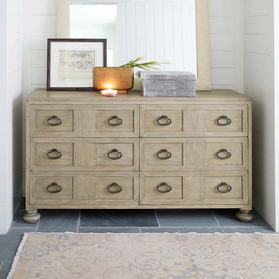 A six drawer dresser with subtle carvings within the front panels.