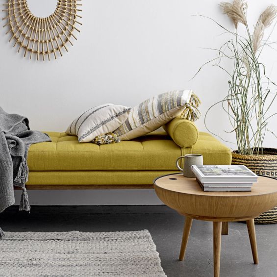 A gorgeous Nordic-inspired round oak coffee table with a removable top