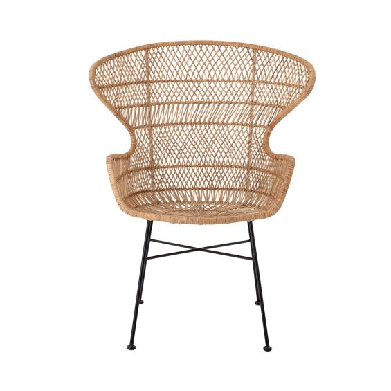 A luxurious woven rattan armchair with metal legs