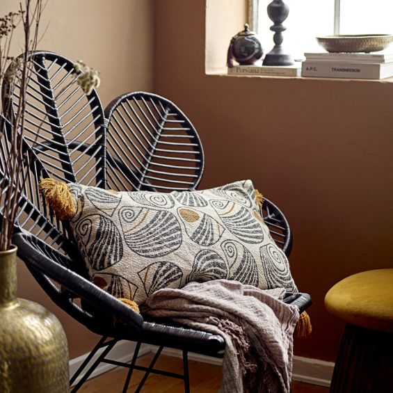 A gorgeous yellow and black patterned rectangular cushions with yellow fringing