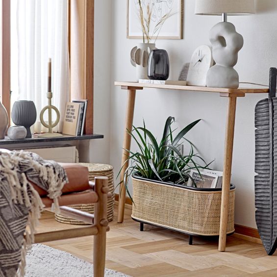 A gorgeous plant box with a woven rattan finish, rounded edges and a beautiful black frame