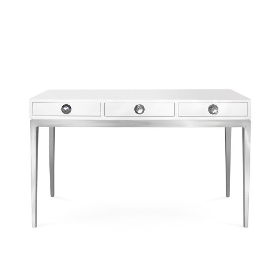 A futuristic white console table with blue acrylic cabochons and a polished brass base 