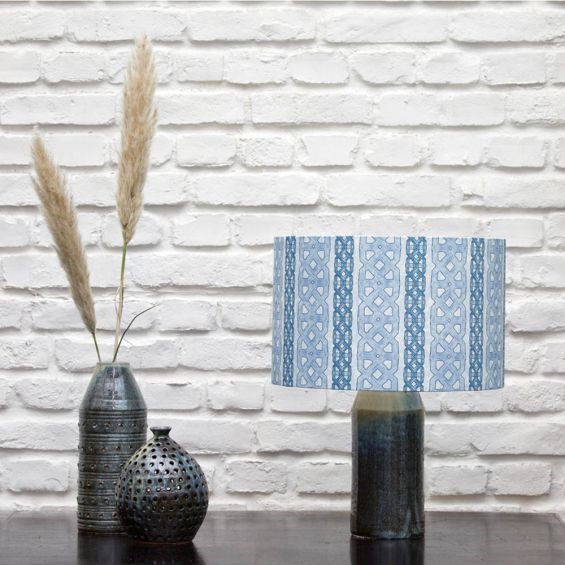 A luxury lampshade by Eva Sonaike with an indigo African-inspired pattern