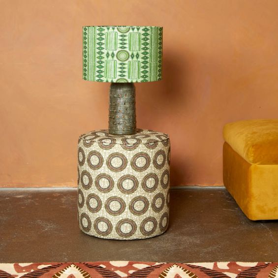 A luxury green lampshade by Eva Sonaike with an African-inspired pattern