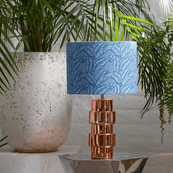 Dreamy blue lampshade with repeated leaf pattern and copper interior