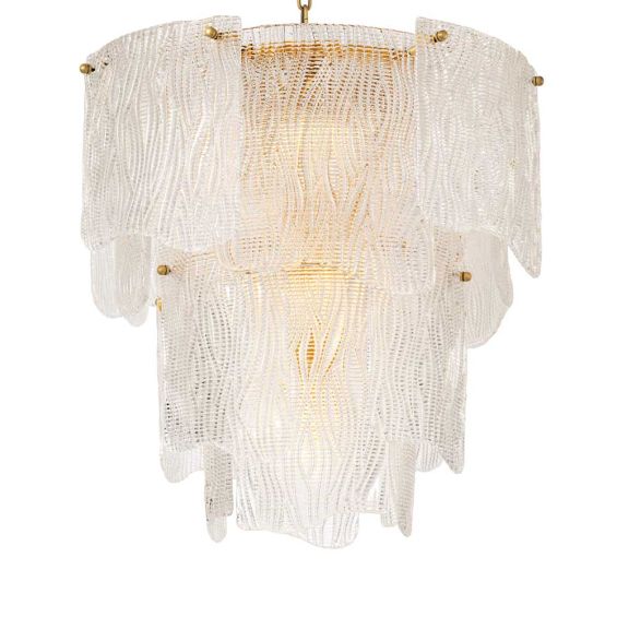 An elegant chandelier with textured glass reflects a warm, radiant glow.