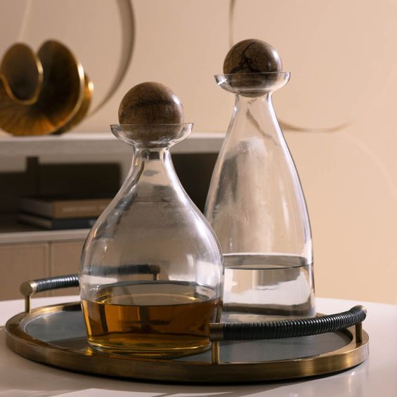 Curvaceous glass decanter with brown marble sphere caps