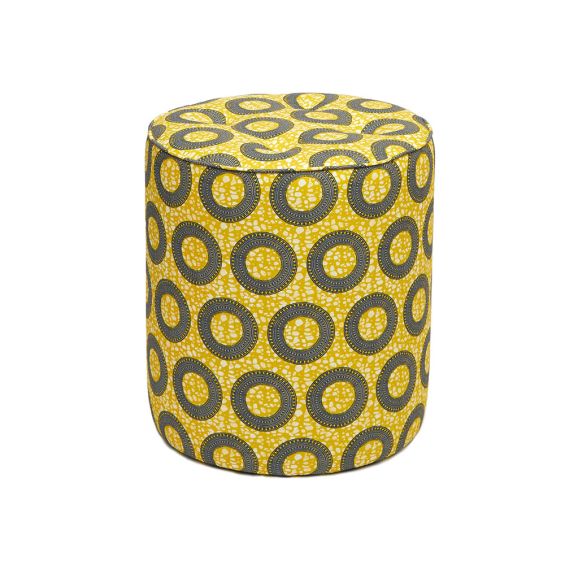 A luxury pouffe by Eva Sonaike with a yellow African-inspired pattern